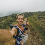 Family hiking with baby in carrier