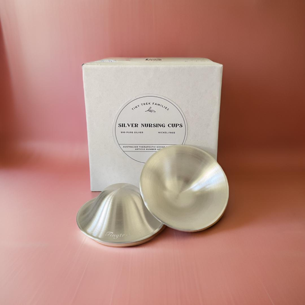 Tiny Trek Silver Nursing Cups on Pink background and box